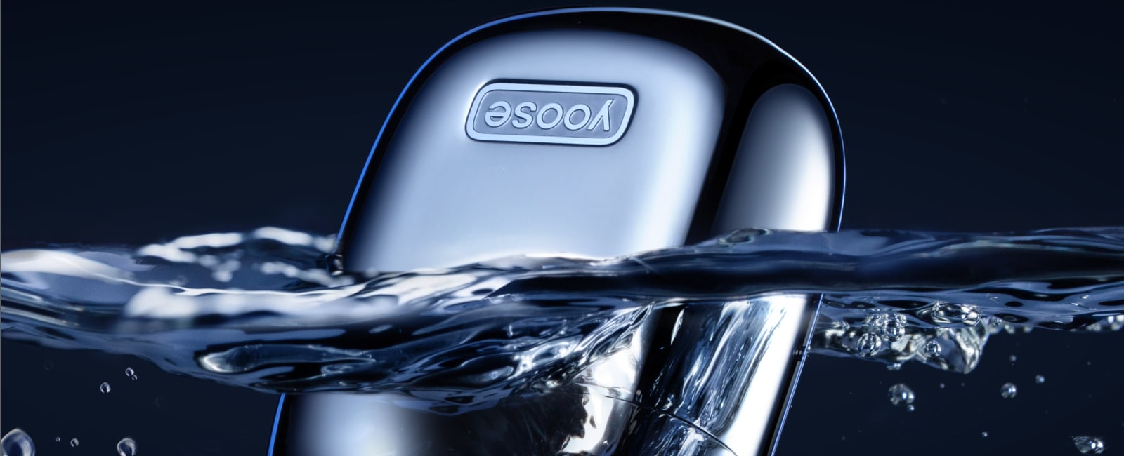 YOOSE Mini shaver being rinsed under running water